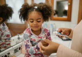 Child preparing to brush teeth