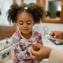 Child preparing to brush teeth
